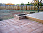 patio squares with tumbled paver block planter accent